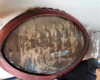 Antique photo of football team in a wooden football frame