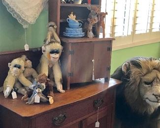 A primitive farmhouse washstand and a salesman sample cabinet.