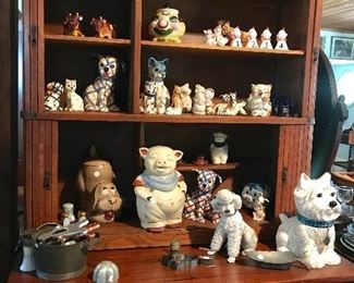 Salt snd pepper shakers and cookie jars on a fabulous Hoosier cabinet