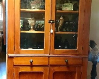 Primitive, wavy glass hutch