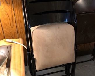 Folding chairs with padded seats