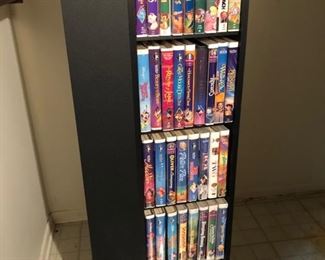 Media storage rack and tons of Disney VHS