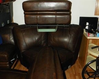 5 piece premium leather triple reclining "L" shape pit group.