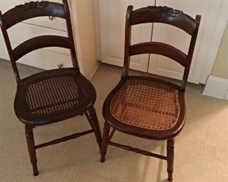 Two old cane bottom chairs