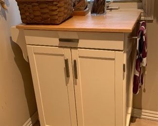 Kitchen island on wheels with the butcher block top