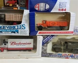 1 lot, AHL 1/64 Rack Stake Truck/Army Duce and 1/2 Truck/1930 Chevy Stake Truck/Speccast Peterbuilt 383 Bud Truck, NIB