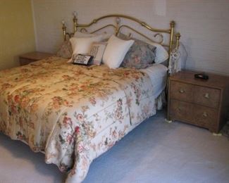 King bed with a brass headboard