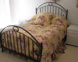 Full size bed with cast-iron frame headboard and footboard