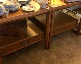 Pair of mid century side tables with single storage drawers. 