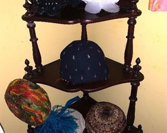 Vintage hats on a lovely corner shelf 