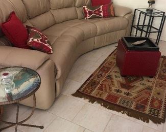 Tribal rug, curved sofa, mirrored side table, fun pillows