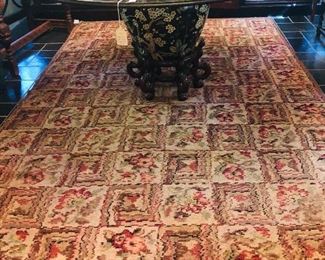 Antique multi color rug, glass top table on oriental fish bowl, 60" dia.