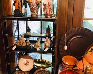 Neat small oriental, black & gold display cabinet or book stand, with oriental figures next to table with terra cotta items, basket lamp, bronze platter