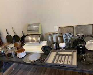Kitchen Items: pots, pans, baking trays, muffin tins, silverware drawer (adjustable), splatter shields, electric frother, bread bin, antique wrap dispenser, mini crockpot