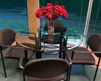 Round glass top table with 4 chairs