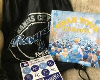 Kansas City Royals drawstring backpack and Grab Your Crown collector book from World Series celebration