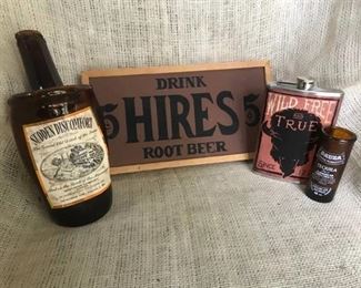 A variety of fun items/decor--smashed Southern comfort bottle, Wood Sign, shot glass and buffalo flask