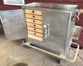 Steampunk, stainless steel, surgical, nurse, hospital, laboratory rolling cart cabinet with drawers.
