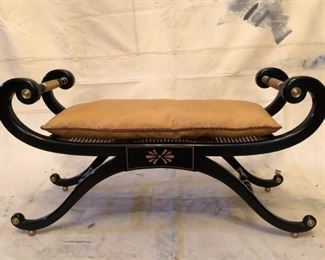 Neoclassical carved and lacquered wood bench with cane seating and upholstered cushion.