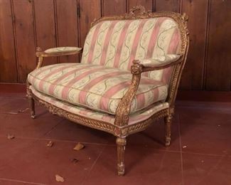 Rococo gilded and upholstered love seat.