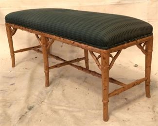 Bamboo porch bench with upholstered cushion.