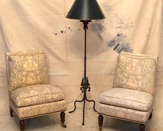 Set of 2 upholsetered chairs and an iron floor lamp.
