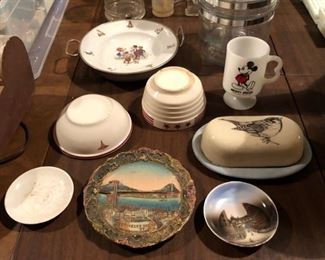 Antique Brooklyn Bridge dimensional souvenir plate, Mickey Mouse Fire King mug, childs food warmer plate, covered butter with bird artwork, assorted small glassware.