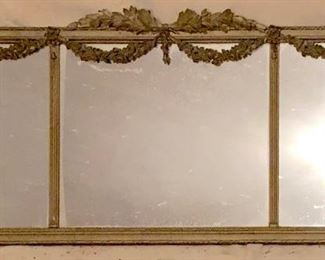 Large, sofa-sized neoclassical wall mirror.