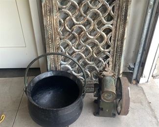 Heavy cauldron and decorative wood screens and unusual old motor