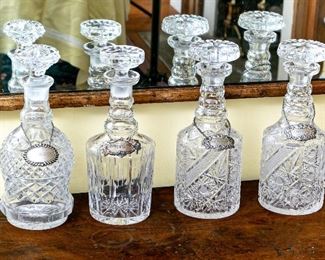 A Group Of Four Vintage Cut Crystal Decanters