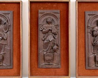 A Group Of Three Carved Wood Relief Plaques