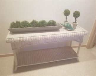 white wicker sofa or entry table