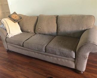 Comfy cement-colored sofa goes with any house decor!