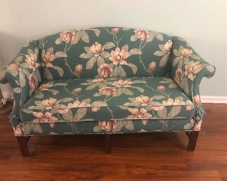 Flowery Aunt Mabel sofa wants you to sit in her lap even if you think you're too grown for that.