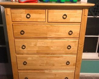 Highboy dresser with 10 sets of lips with resting "OH!" face