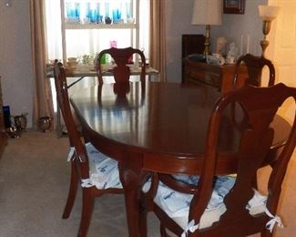 Cherry dining table and six chairs