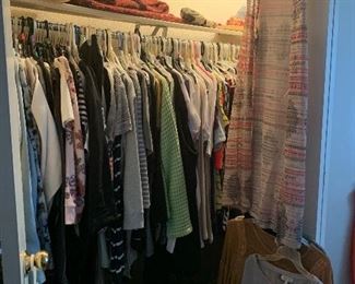 Two closets of women clothing