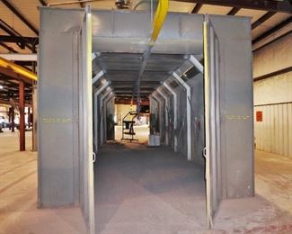 Binks spray booth with an I-beam conveyor system and fire suppression system - includes spare filters and heat lamp – approx. 50’ long