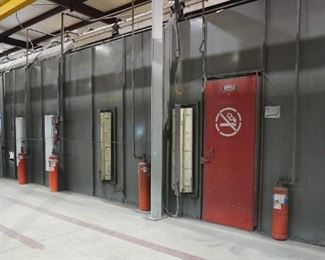 Binks spray booth with an I-beam conveyor system and fire suppression system - includes spare filters and heat lamp – approx. 50’ long