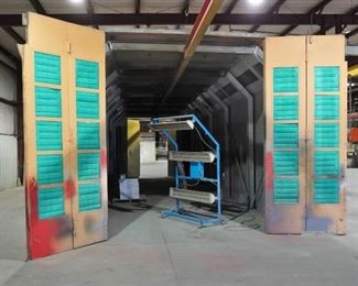 Binks spray booth with an I-beam conveyor system and fire suppression system - includes spare filters and heat lamp – approx. 50’ long