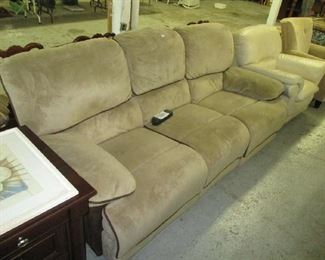 Upholstered sofa with electronic reclining controls