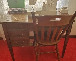 Singer sewing machine in cabinet