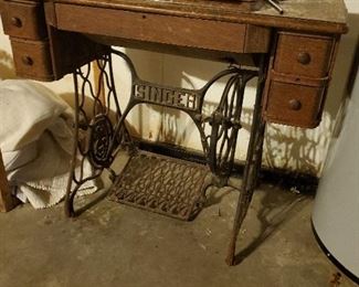 old sewing machine in cabinet, singer