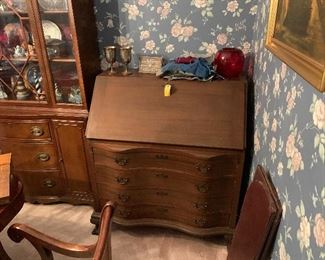 Antique mahogany serpentine front drop front desk