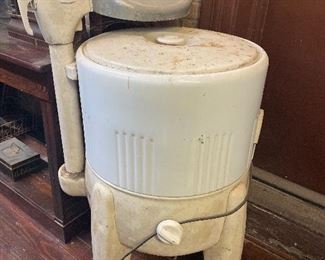 Old white enamel washing machine with ringer from Montgomery Wards, circa 1930
