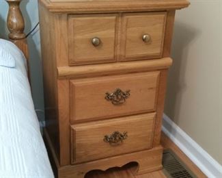 The second of two oak nightstands