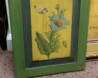 Painted flower on hinged wood.