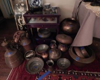 a collection of copper pots and more