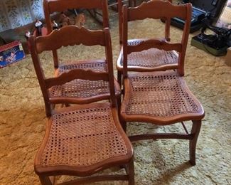 Set of four caned chairs