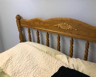 Queen bed frame with pillow top mattress.